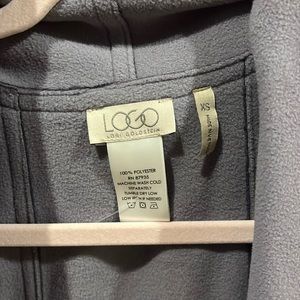 Logo sweater vest. Barely worn and in great condition.